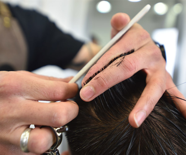 hairdresser cutting a man's hair