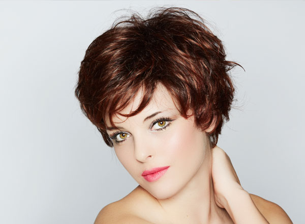 lady with short brown layered hair cut