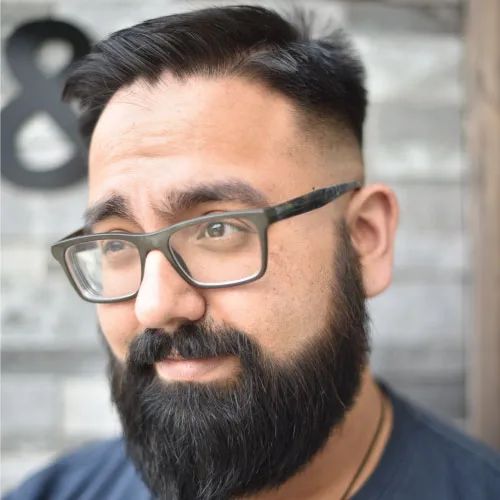 staff at I.C. Partners hair and beauty man with beard and glasses