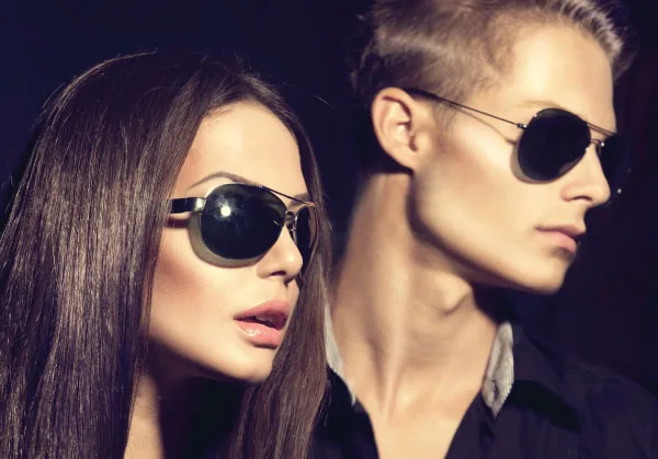 hair treatments man and woman with sunglasses looking to the right