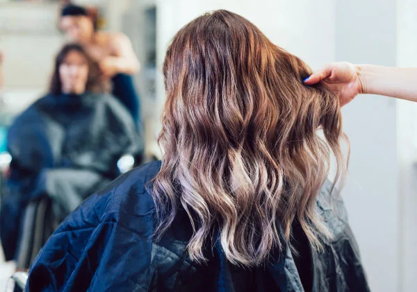 balayage hair treatment Woman with long light brown hair after balayage treatment