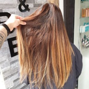 woman with long blonde hair before balayage treatment