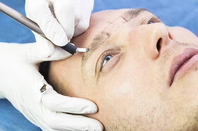 man having microblading treatment